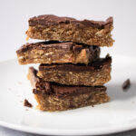 Tahini-date bars stacked on plate