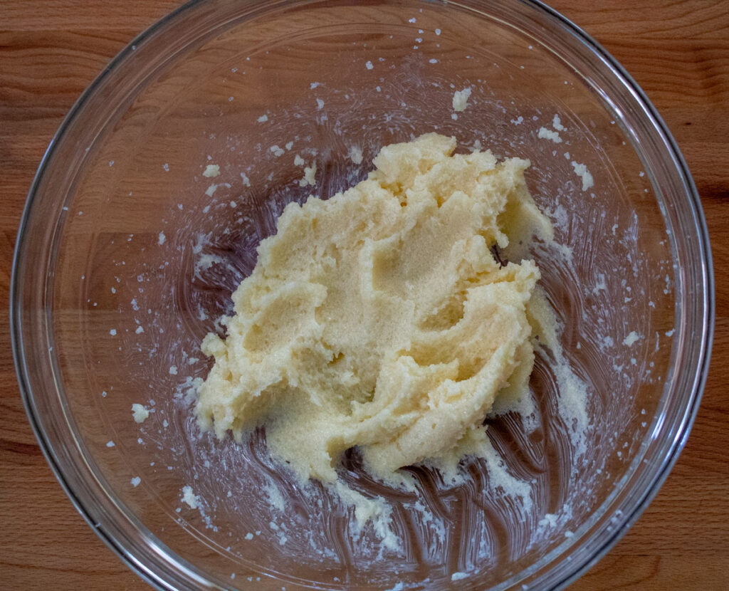 sugar and non-dairy butter creamed in glass bowl