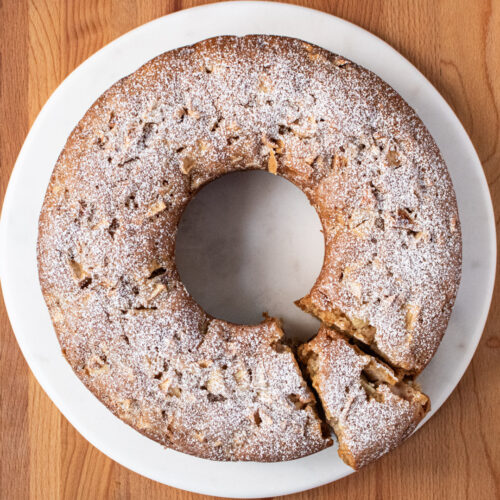 whole apple cake with piece cut out