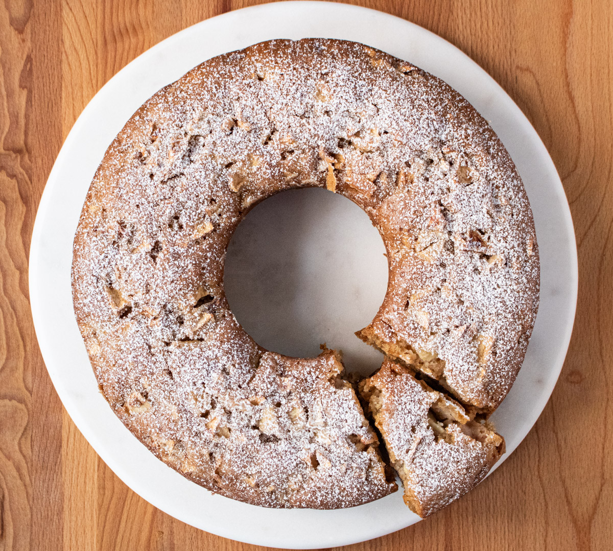 whole apple cake with slice cut out